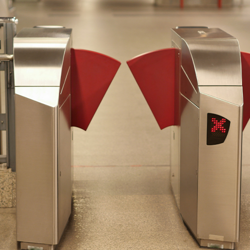 Flap barrier installed for controlled pedestrian access, crafted by a reliable flap barrier manufacturer in India.