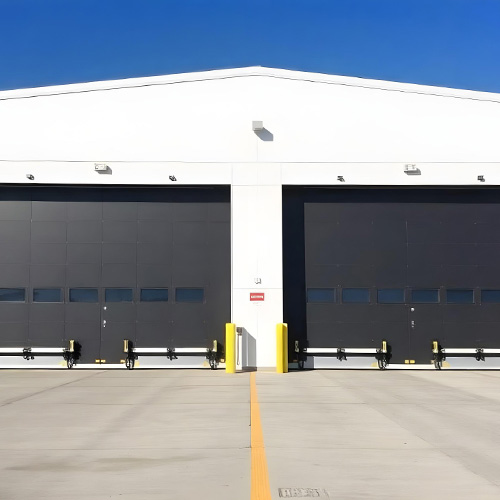 Large hangar doors designed for industrial use, offering durability and precision. Hangar door manufacturer in India providing high-quality solutions.
