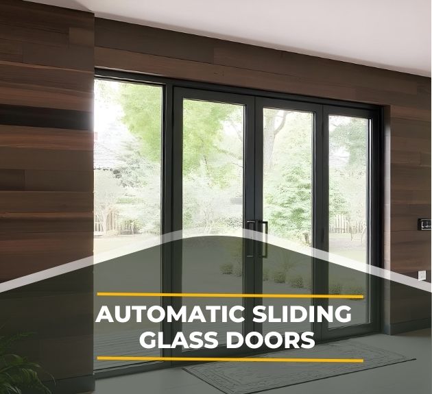 A set of automatic sliding glass doors on a wooden wall, opening to a view of a lush, green garden. Sunlight filters through the trees. Text reads, Automatic Sliding Glass Doors.